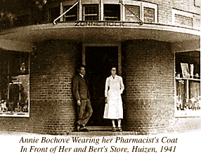 Photograph of Annie Bochove Wearing Pharmacist's Coat, in Front of Her and Bert's Store, Huizen, 1941