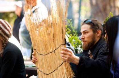 Person holding woven plant materials