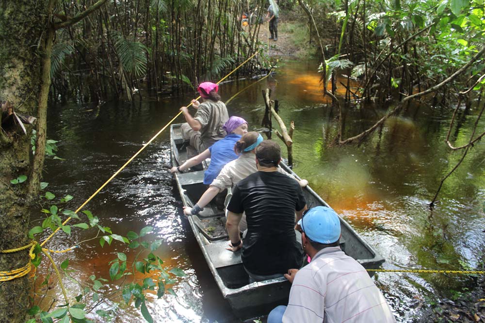 People in a boat in the forest