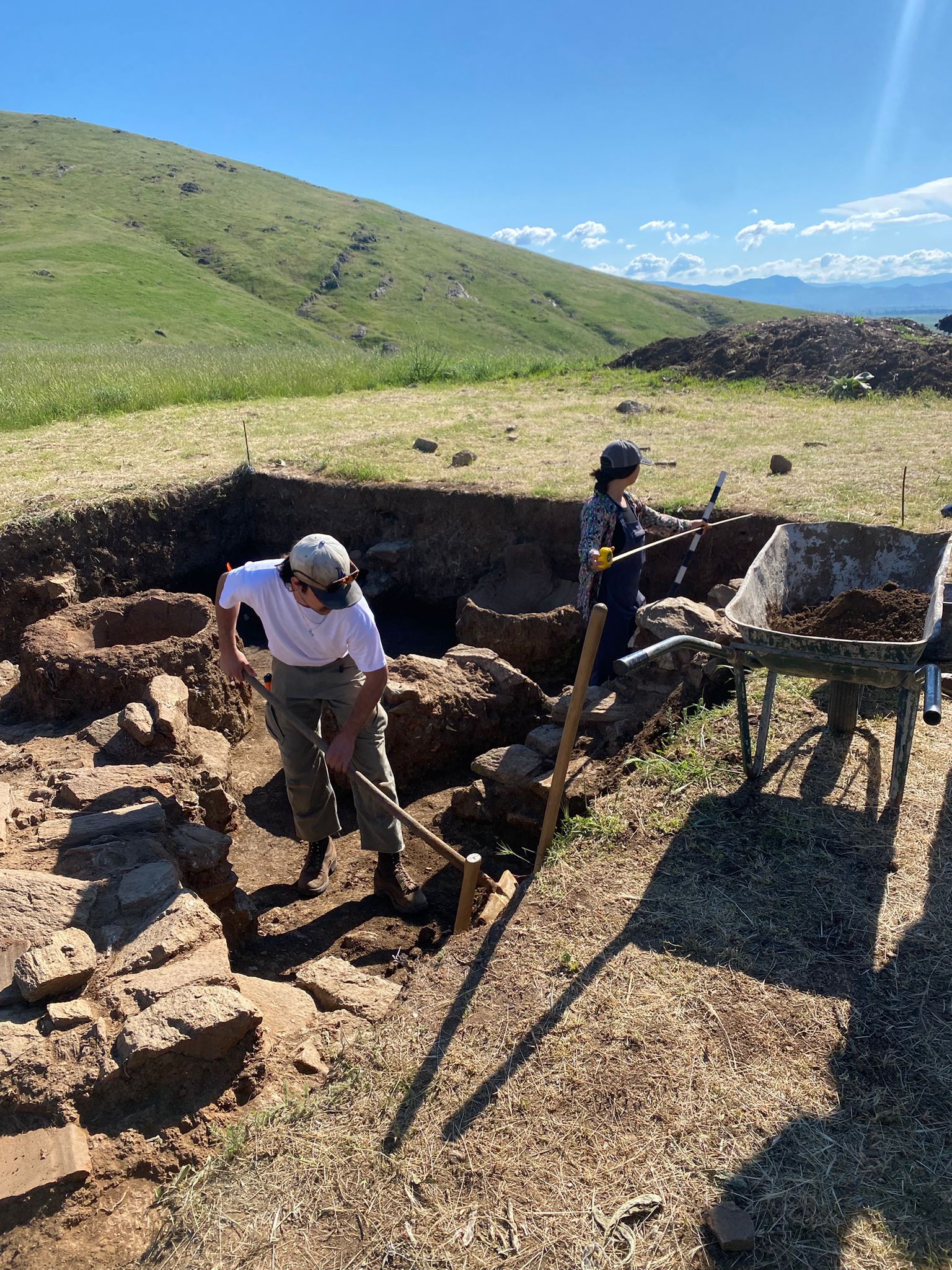 Archaeologists excavating outside