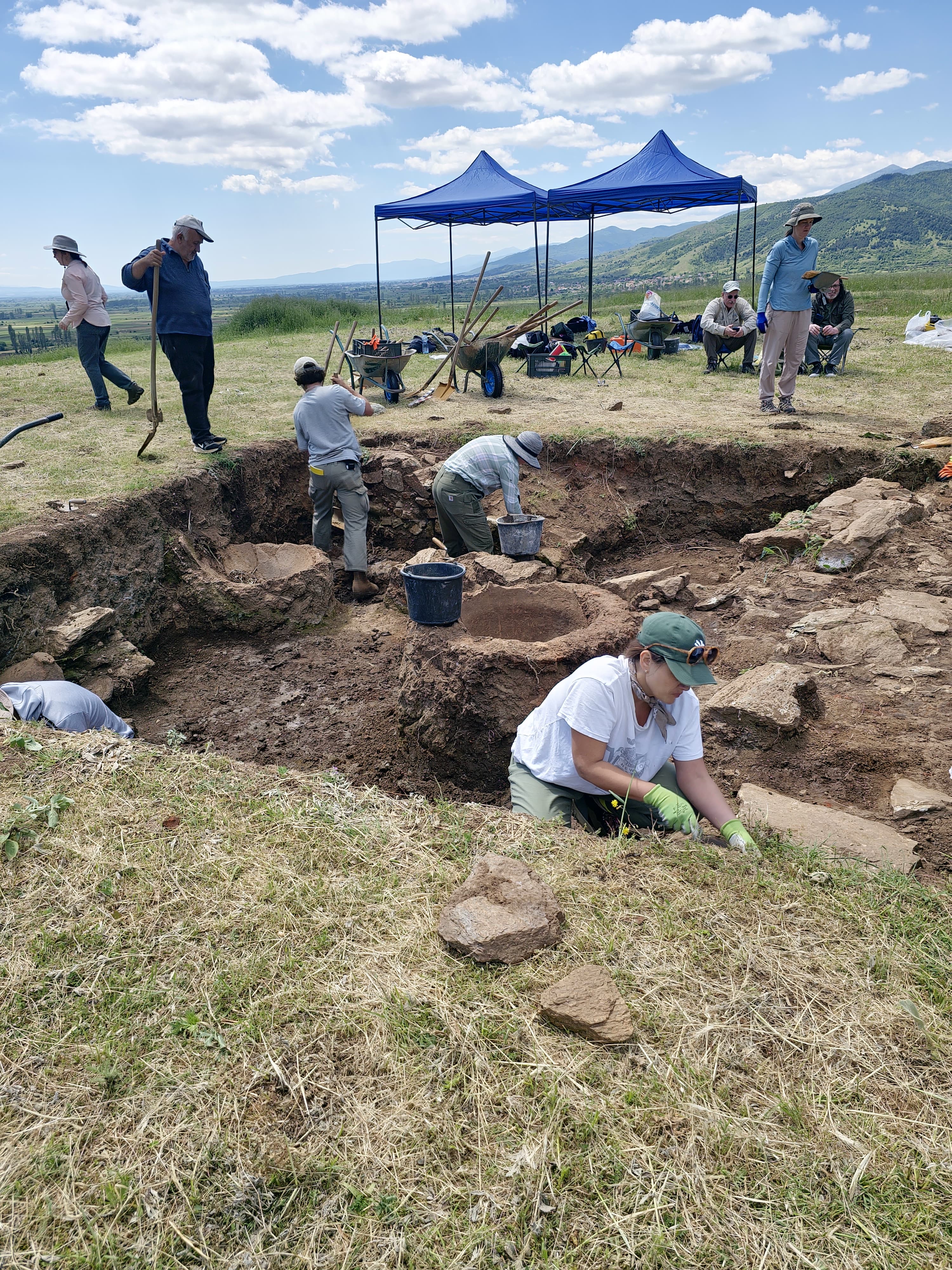 People excavating an archaeological site