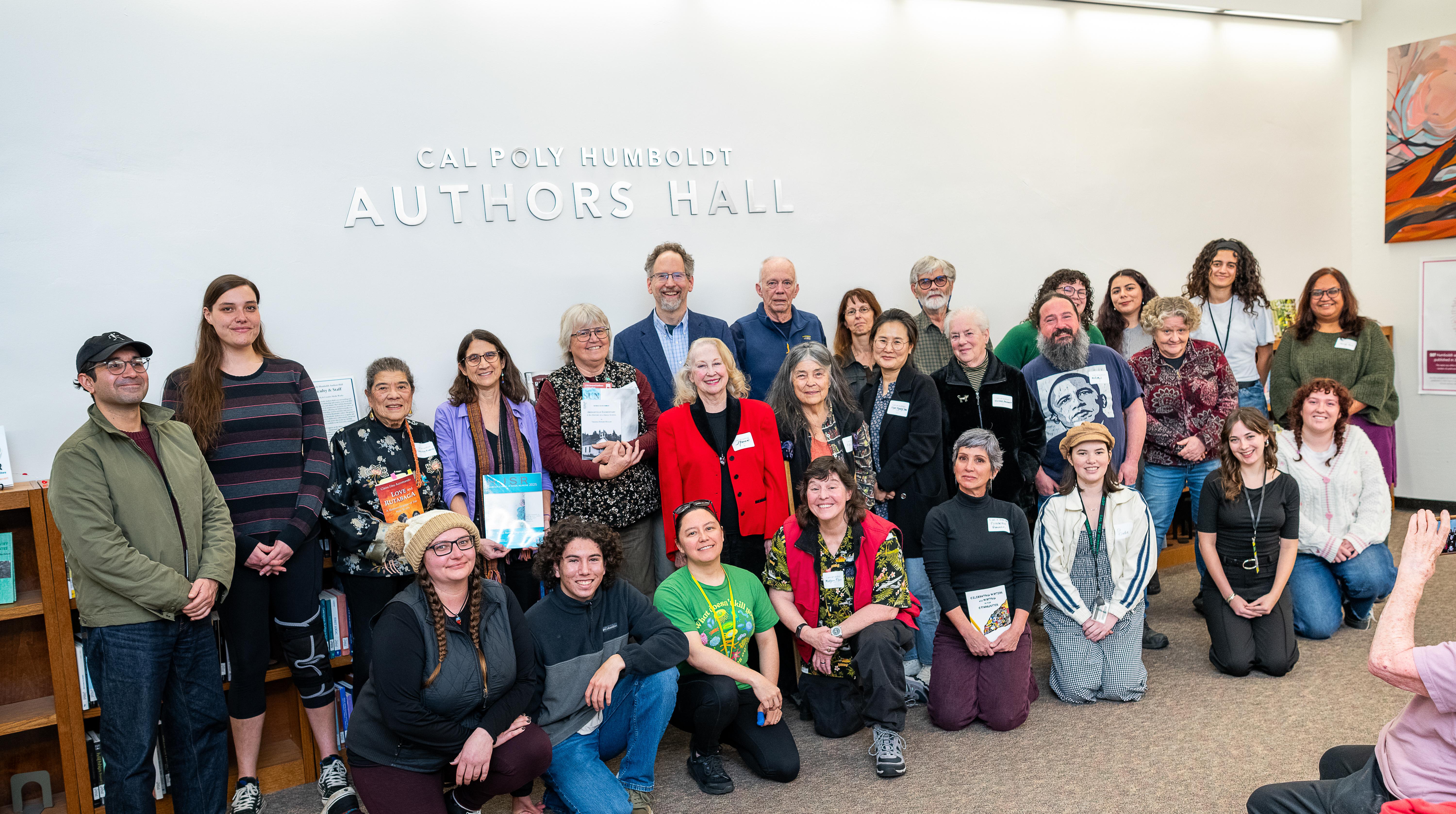 Group photo of 27 authors in the Cal Poly Humboldt Authors Hall. Published in 2025.