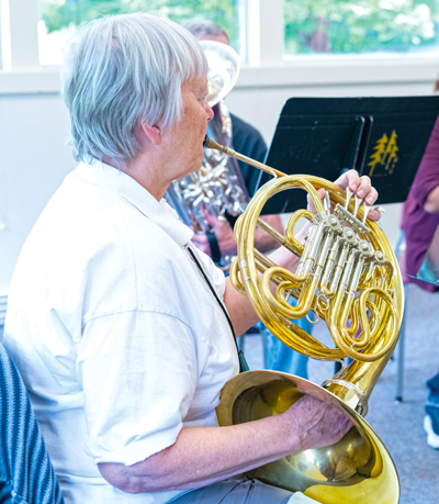 Woman playing French horn
