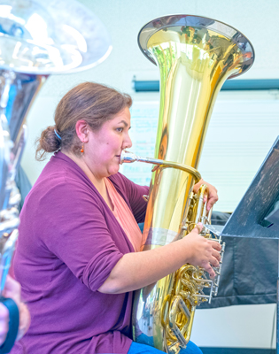 woman playing tuba