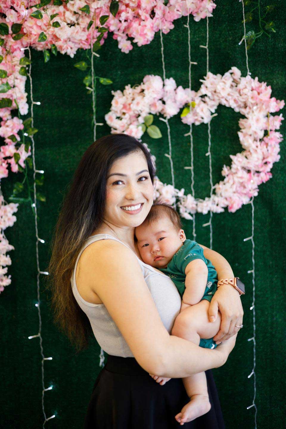 Poua Vang with her child