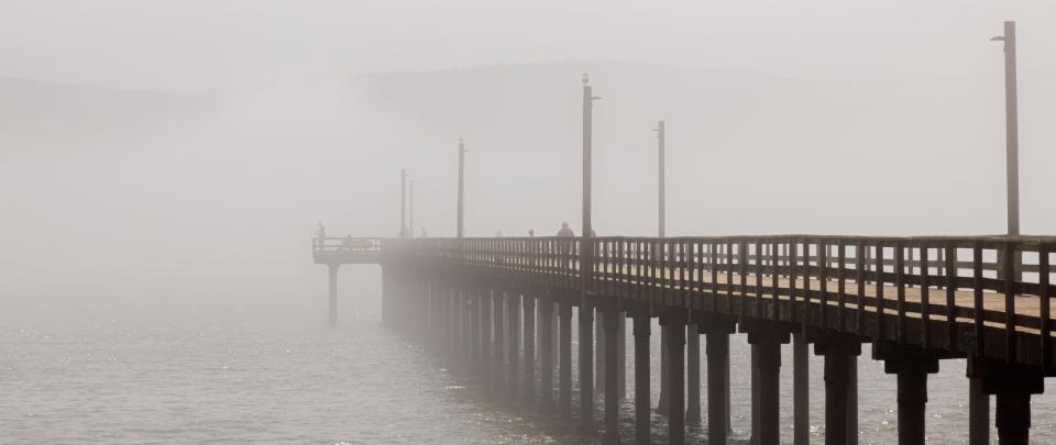 Pier in the water with Fog