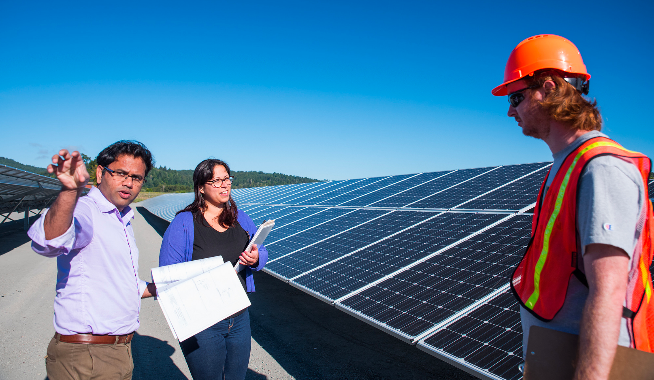 Project members working with solar panels