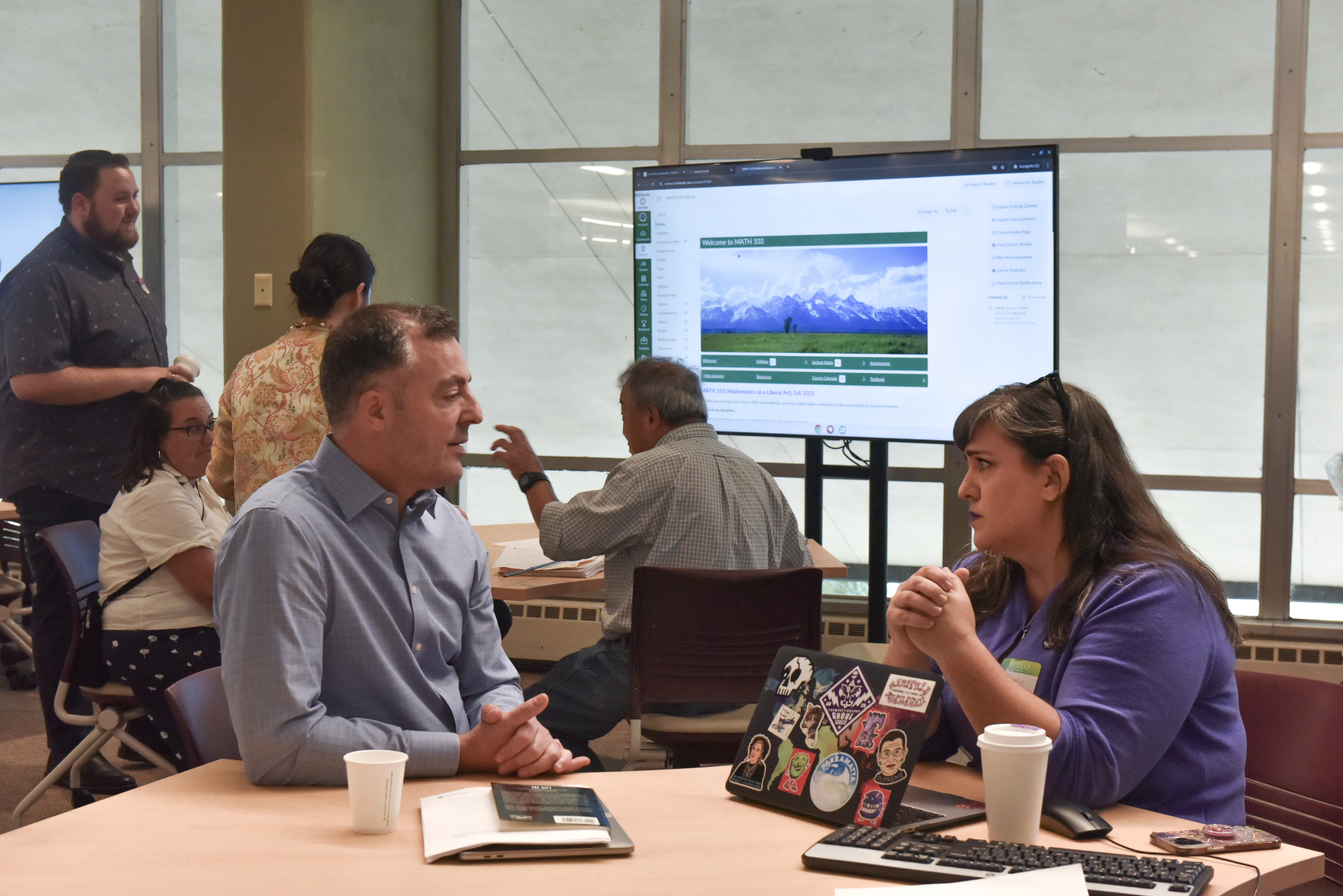 Two educators at the 2025 Teaching Excellence Symposium