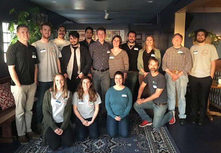 Group of students in three tiered rows smiling for the camera