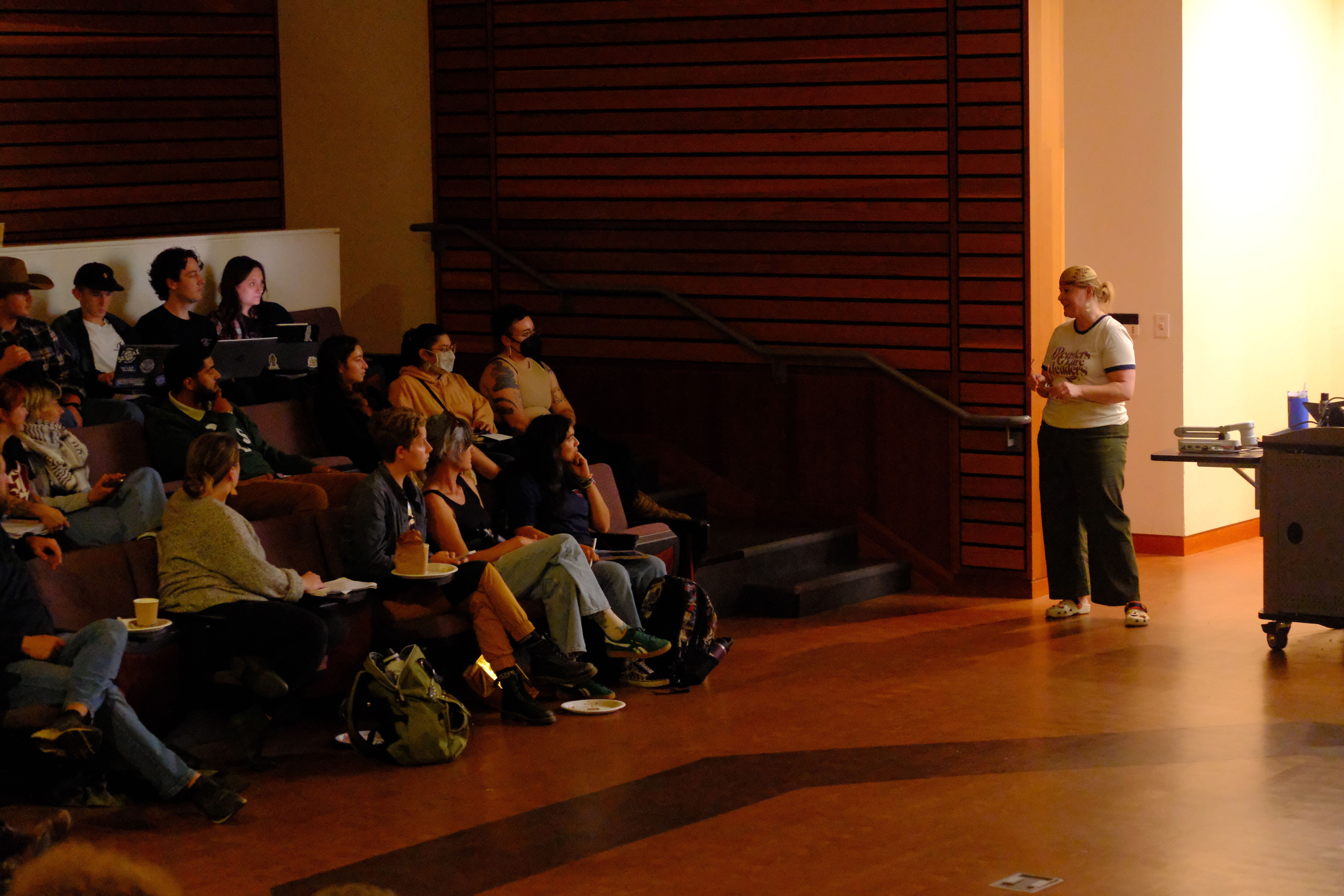 Chef Sara on the right side in the Native American Forum giving her Book Talk to an audiance on the left side.