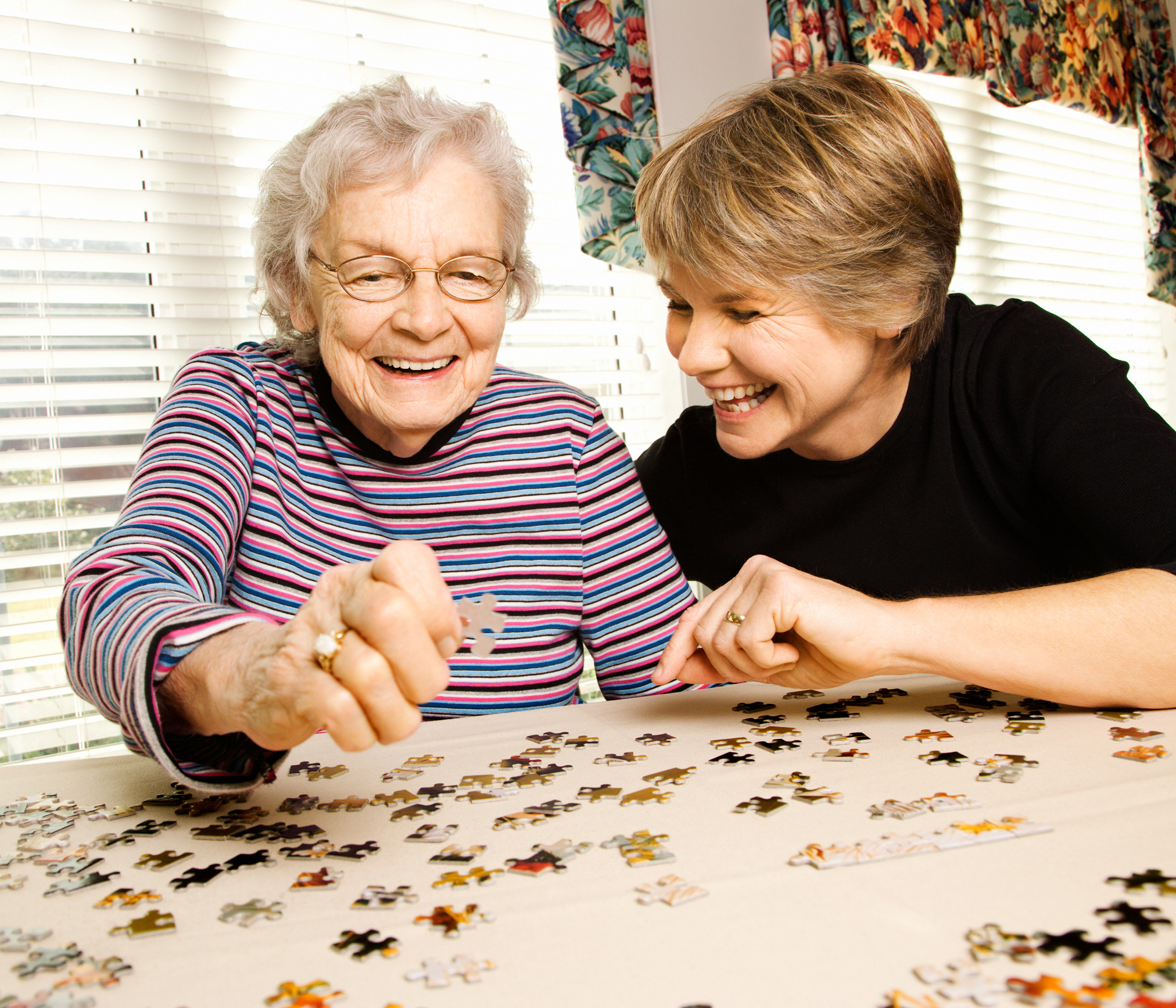 two women working on a puzzle