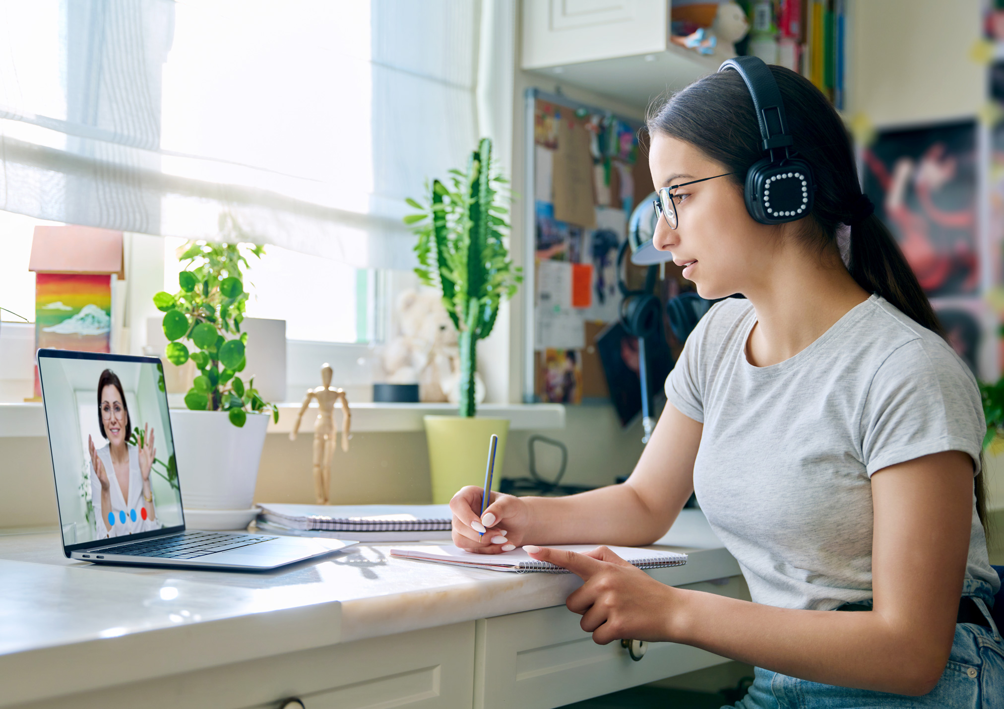 Woman on laptop, talking to advisor