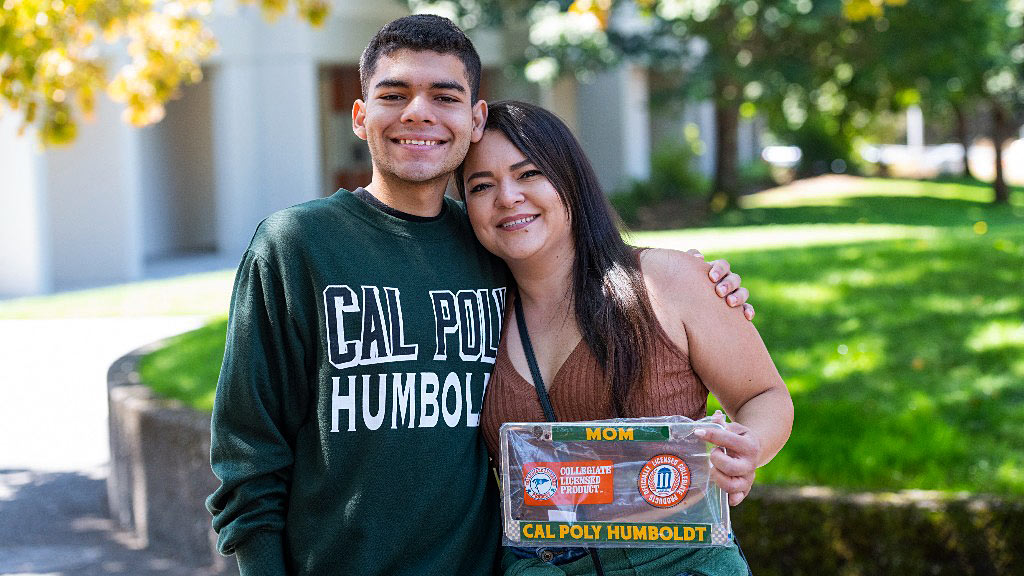 student with mother and some Cal Poly Humboldt gear