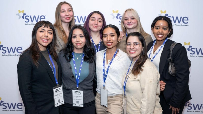 A group of eight members of the Society for Women Engineers.