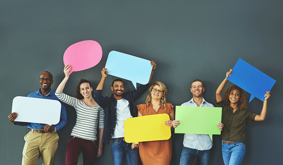 Group of people holding colored thought bubbles