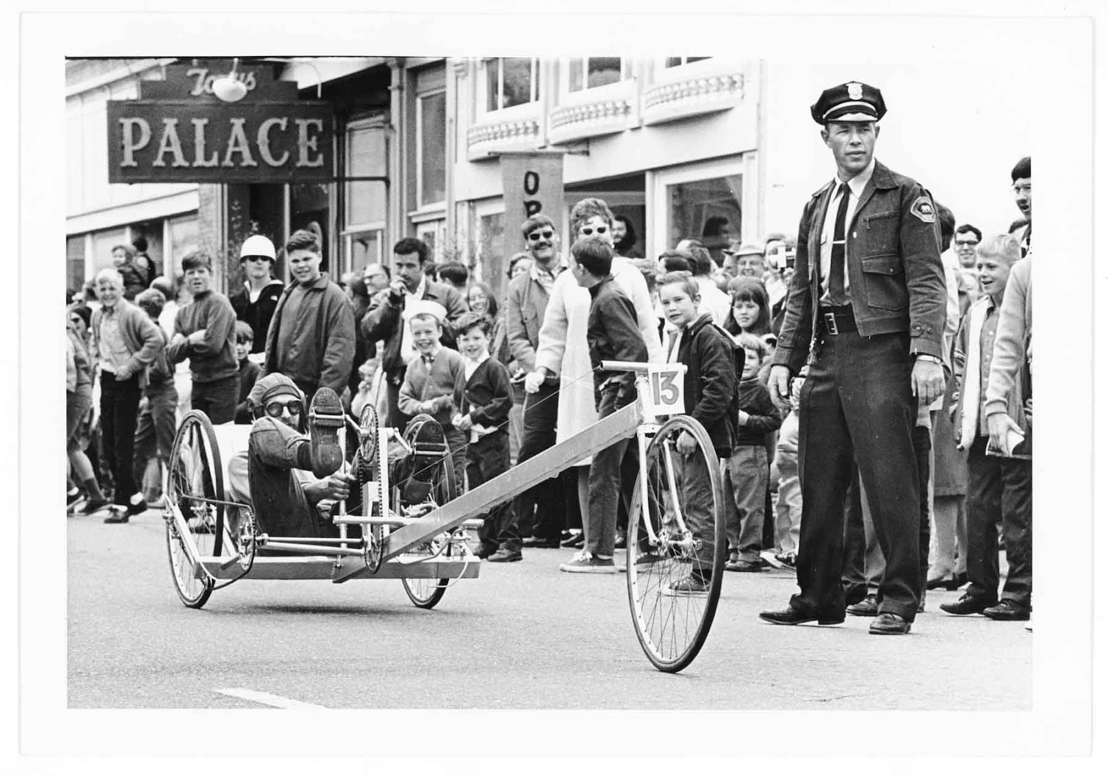 A Man Pedaling a Kinetic Sculpture 
