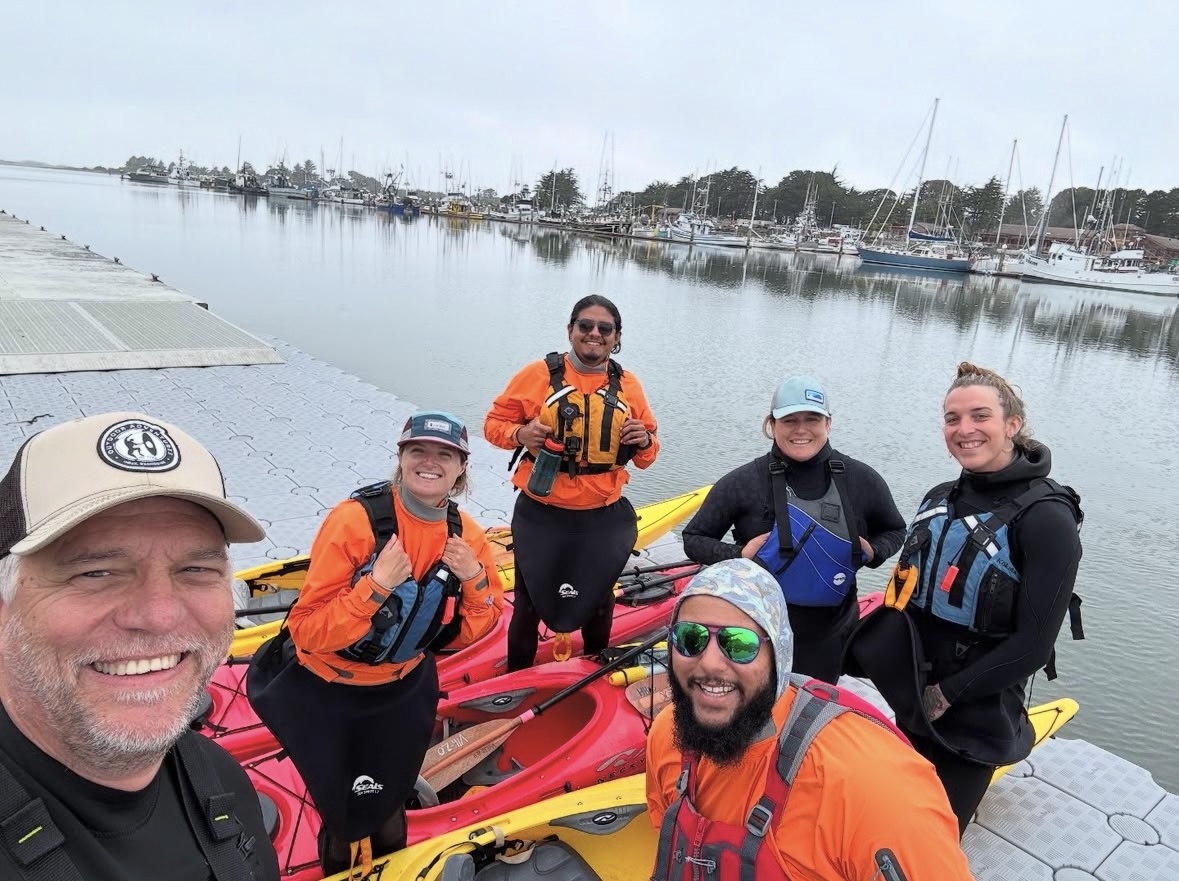 Instructor and course participants celebrating a successful American Canoe Association Kayak Instructor training