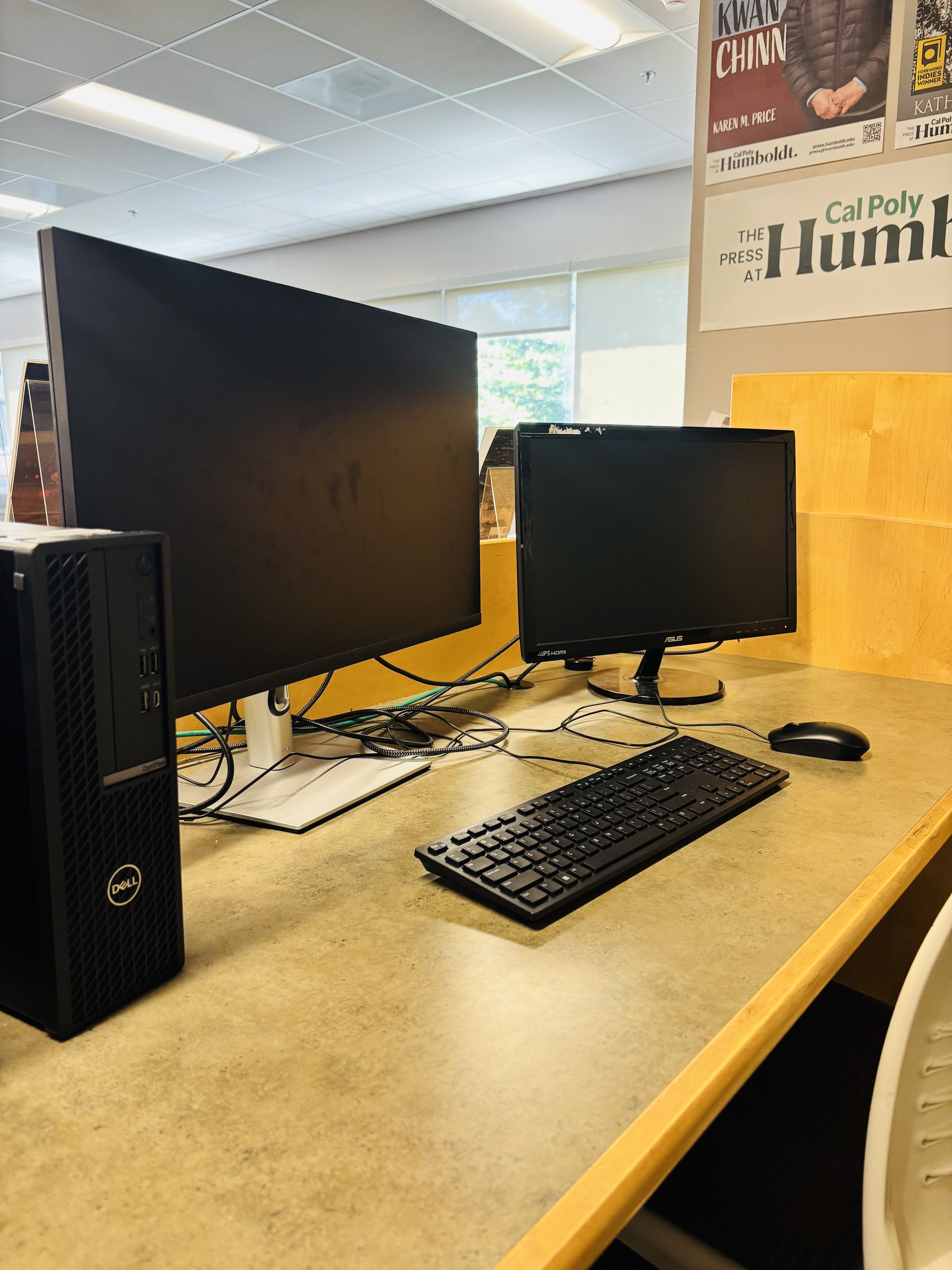2 screen computer with single keyboard and mouse, inside Cal Poly Humboldt Library.
