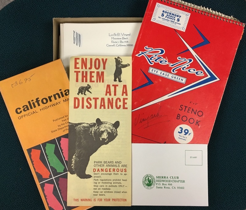 Pamphlets and papers, one with a bear that says "enjoy them at a distance, one is a California highway map, one is a Sierra club postcard and one is a "Rite Nice" red notebook