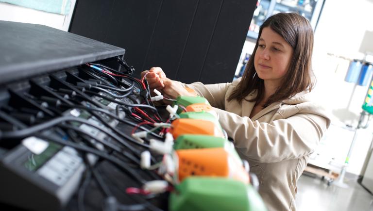 student working on a piece of equipment