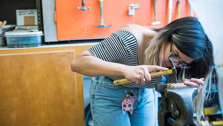 Student working with fine metals