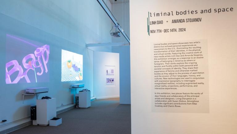 View of Reese Bullen Gallery with projections in a darkened space, and text explaining the Liminal Bodies and Space exhibition
