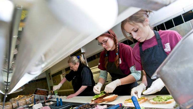 Working making food in kitchen