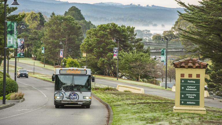 Bus driving on the roads towards campus