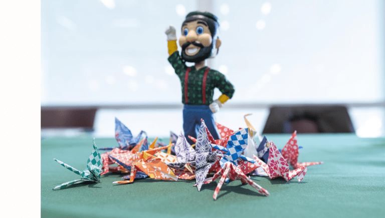 Lumberjack Statue with Origami Cranes
