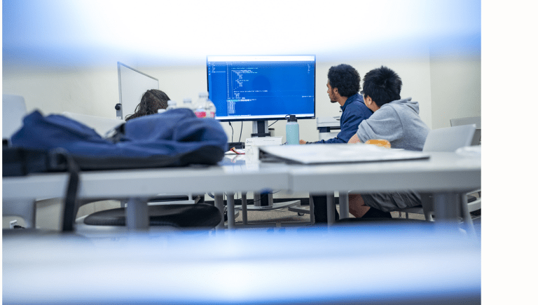 Students studying together at a computer