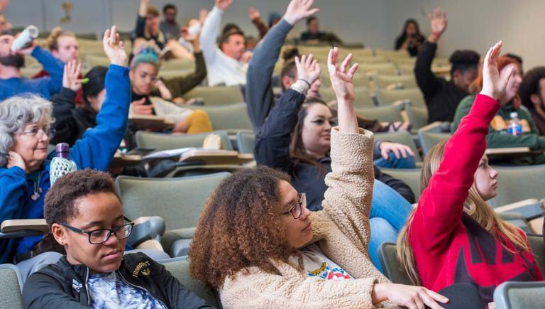 Students raising their hands