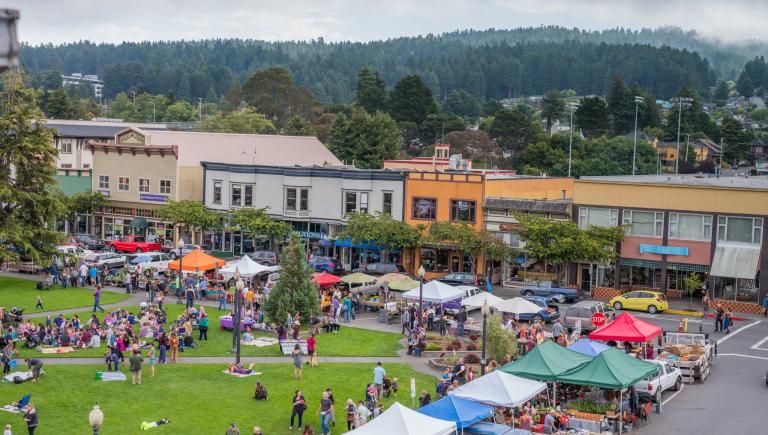 A scene from the Farmers' Market in downtown Arcata with vendor tents