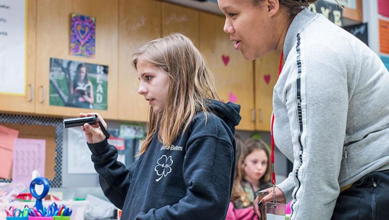 Teacher working with student