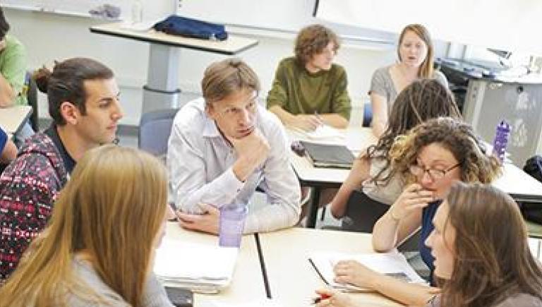 image of people talking at a table