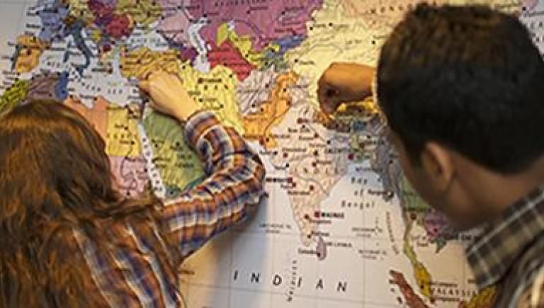 image of people looking at a map