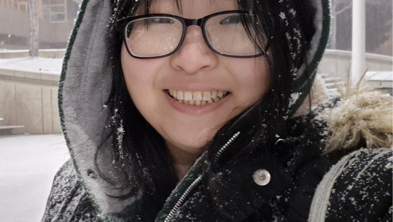Student in the snow smiling