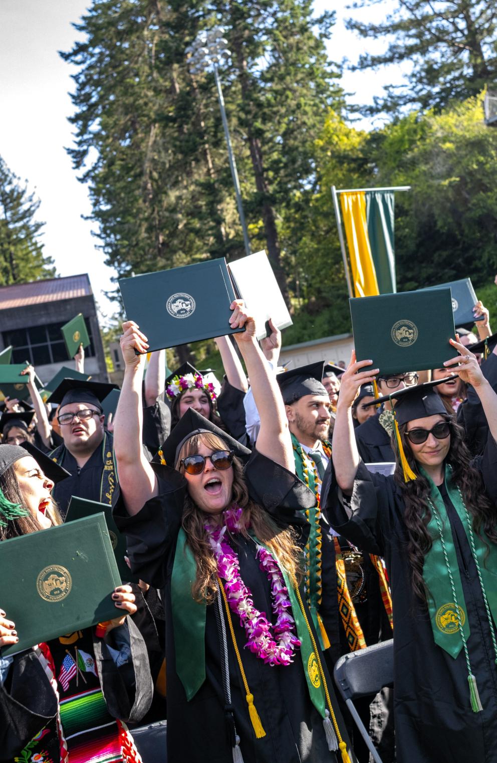 A photo of graduates celebrating.