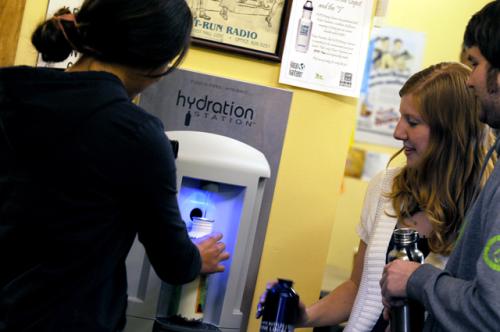 Photo of students using the Hydration Station water dispenser in the Depot