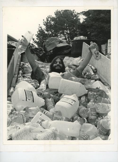 Photo of CRP student in a pile of recycling