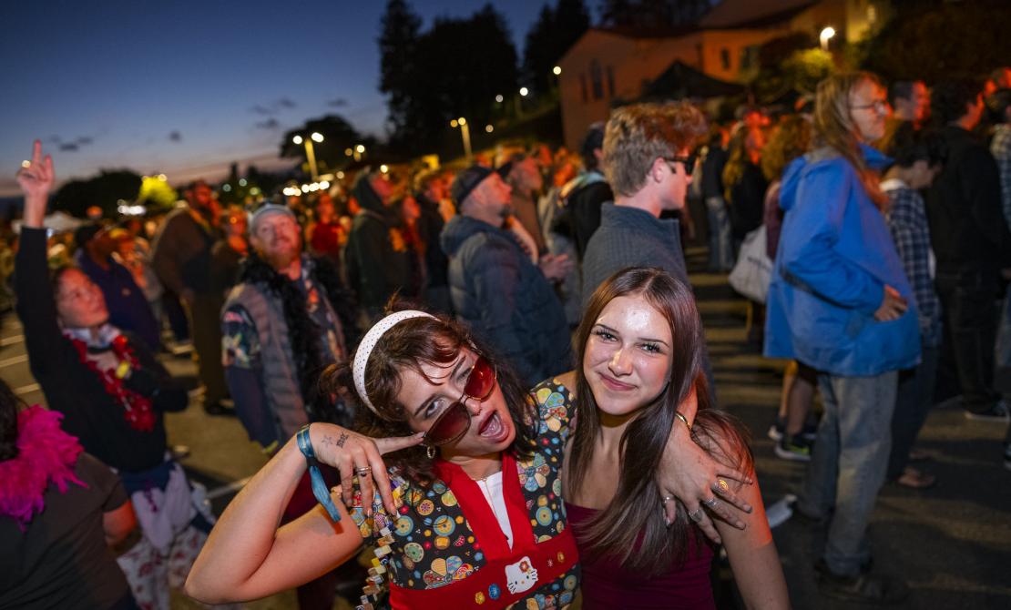 Two students at Lumberjack Weekend Block Party 2025