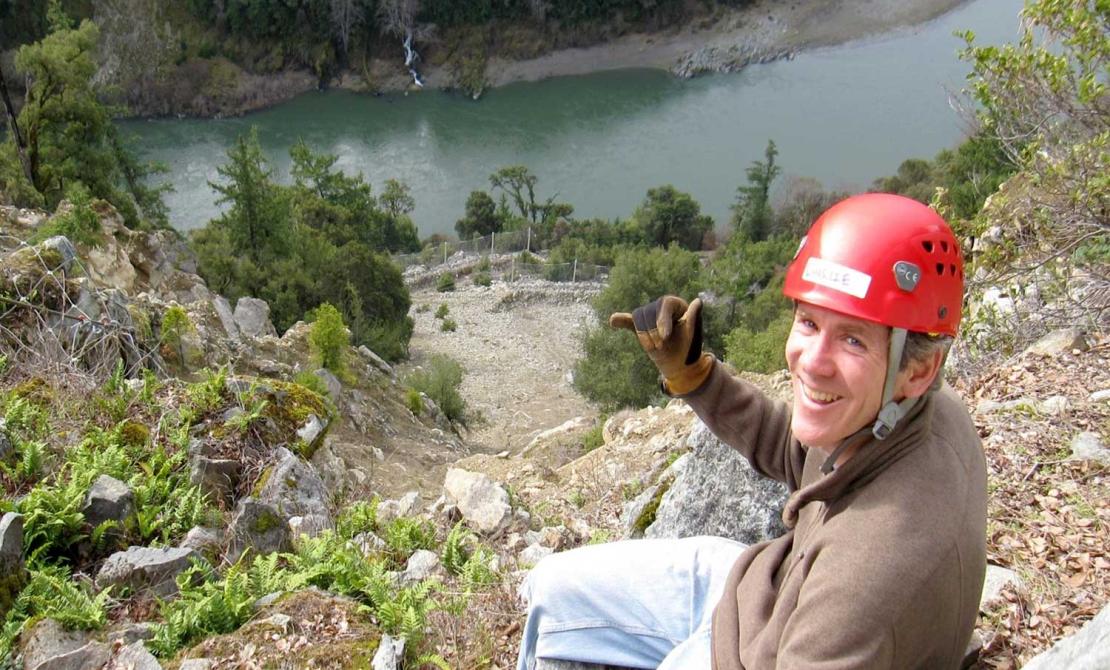 Charlie Narwold on a rocky slope high above a river