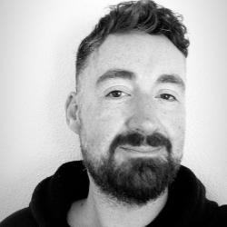 Grayscale photo of person wearing a dark-colored shirt