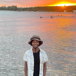 Person with a body of water in the background