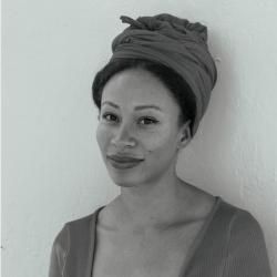 Person standing against a wall