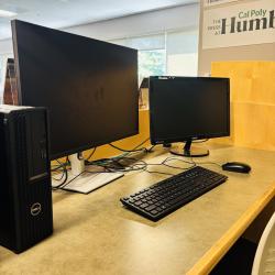 2 screen computer with single keyboard and mouse, inside Cal Poly Humboldt Library.