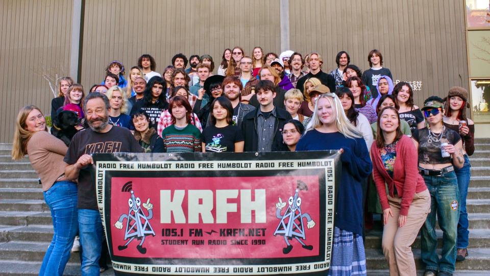 A group photo of more than 40 KRFH radio students on a set of outside stairs.