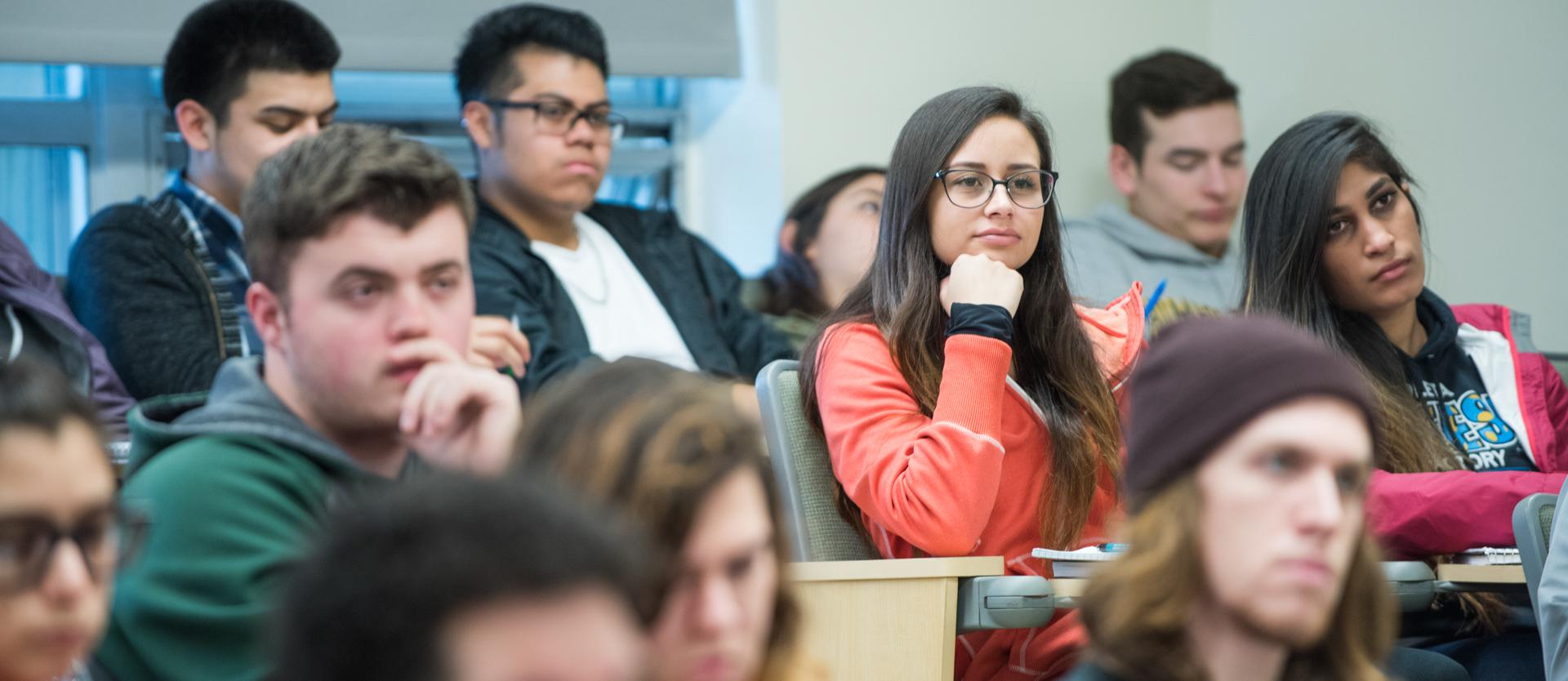 Student in class watching teacher