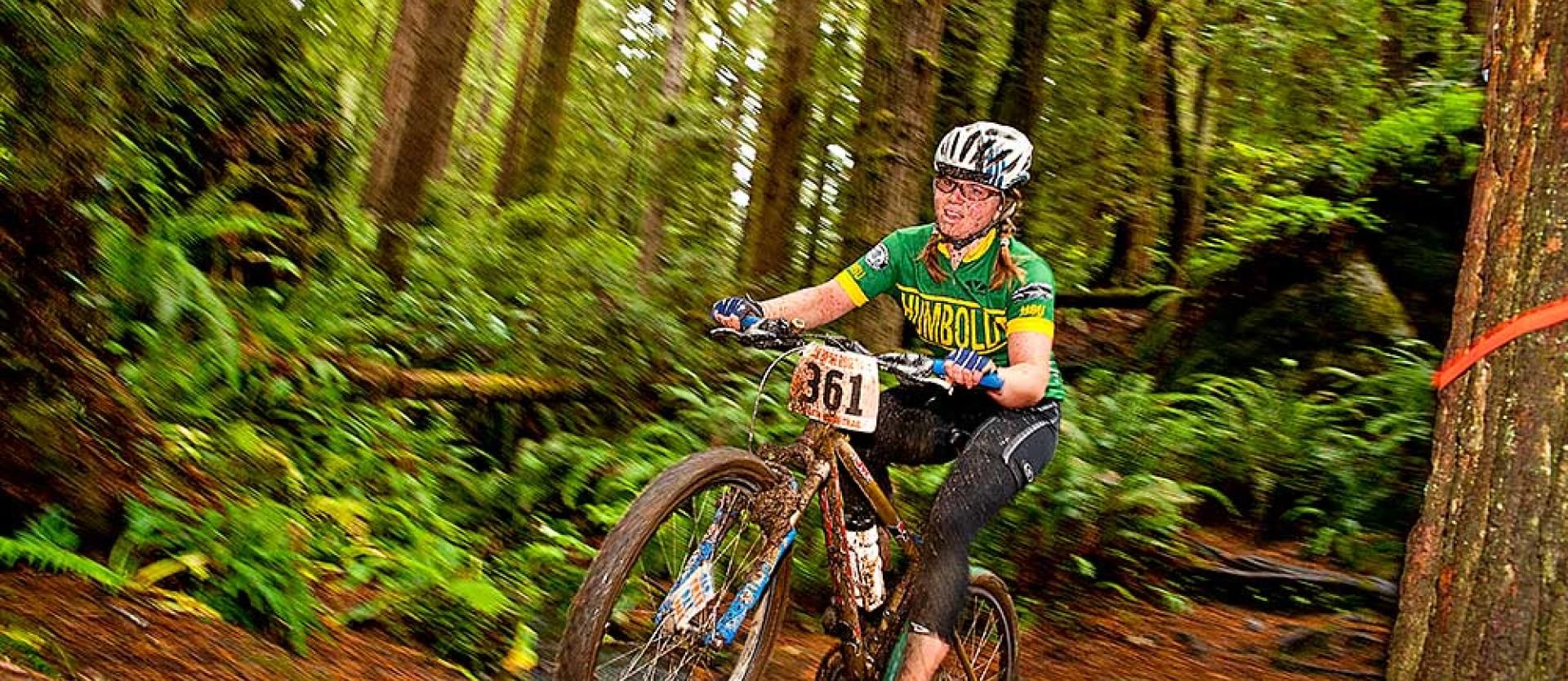 Member of the Humboldt Cycling Club racing to victory during local race in Arcata Community Forest