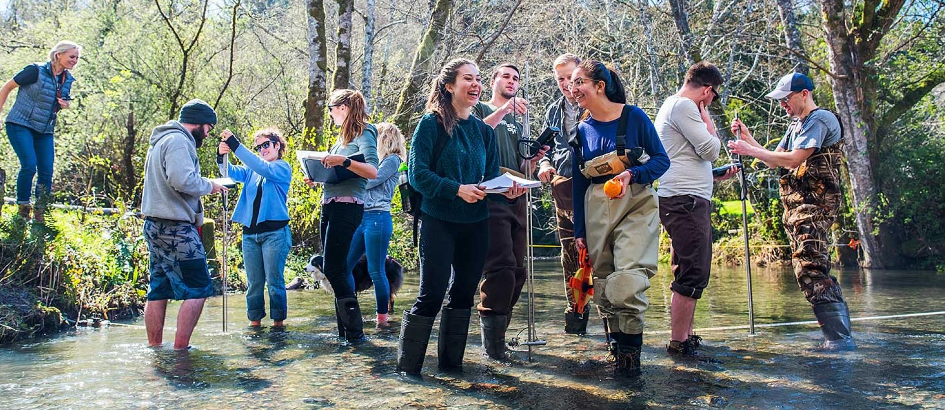 Engineering Students taking measures in a creek