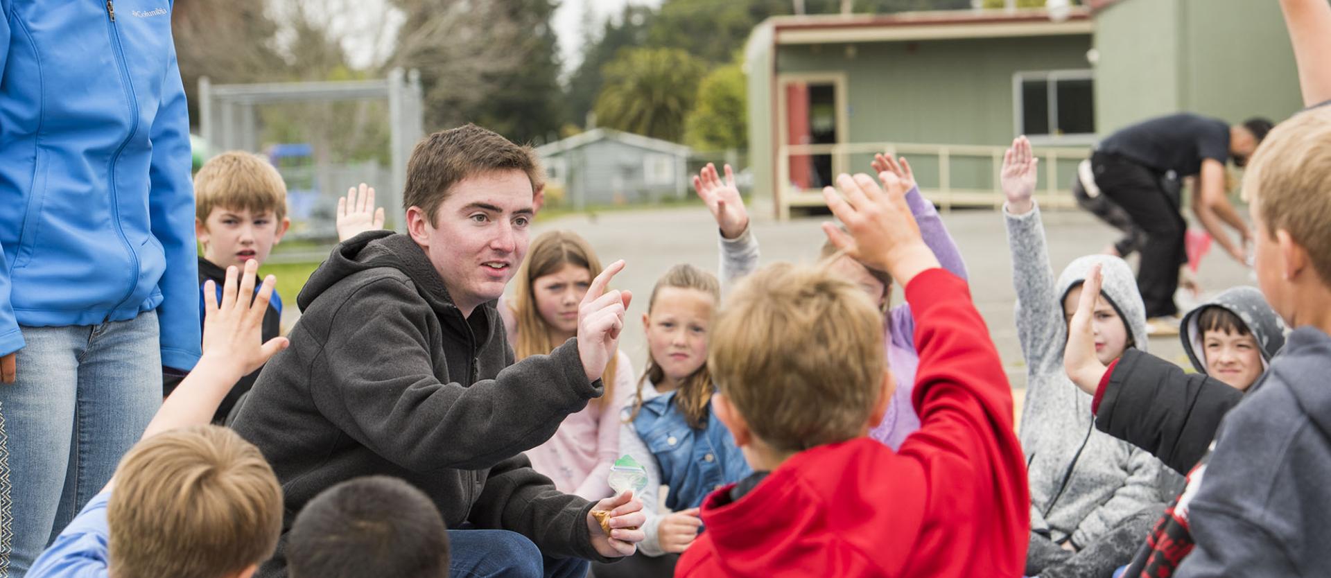 A group of children outside with a teacher